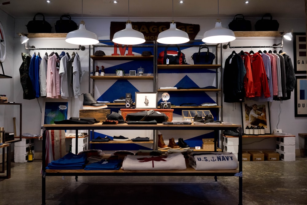 A colorful boutique clothing store with shelves and racks